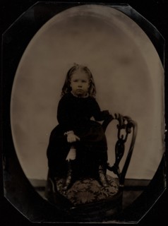 Portrait of a Little Girl Standing on a Chair, 1870s. Creator: Unknown.