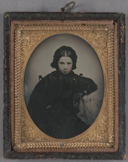 Portrait of a young girl dressed in dark clothes, wearing dark gloves, about 1860. Creator: Unknown.