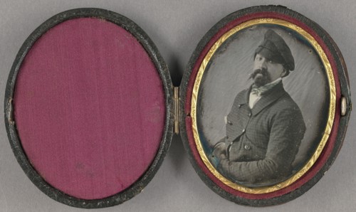 Portrait of a man with a busy moustache and goatee, wearing an angled cap, about 1850. Creator: Unknown.