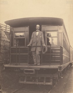 Portrait of an unidentified man standing on rear platform of a train, about 1863. Creator: Unknown.