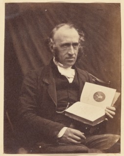 Portrait of Seated Man with a Book, 1870-1875. Creator: Unknown.