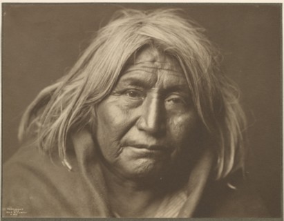 An Apache, 1903. Creator: Edward Sheriff Curtis.