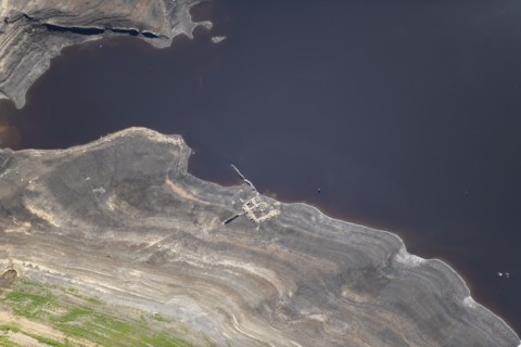 A ruined building revealed by low water levels at Howden Reservoir, Sheffield, 2022. Creator: Emma Trevarthen.