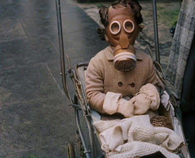 A Young Child in a Pram Wearing a Gas Mask, 1939. Creator: British Pathe Ltd.