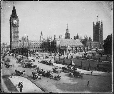 Traffic passing the Palace of Westminster on Parliament Street and Parliament Square, as seen from