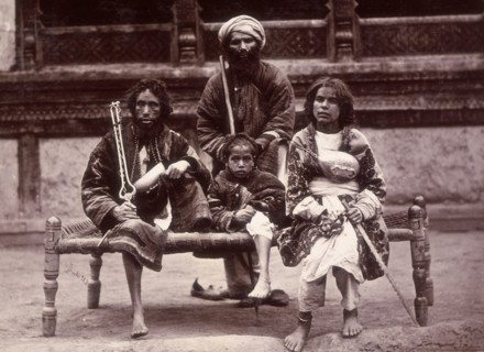 Group of beggars sitting on a charpoy, Kabul, Afghanistan, c1880.