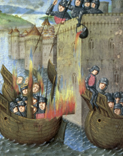 Defenders pour boiling oil onto attacking ships, c1473. Boiling oil is poured from the walls of a