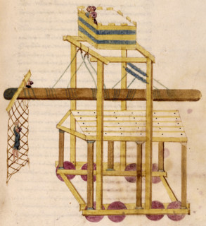 A siege tower, 16th century. A battering-ram is suspended from ropes, with a netted crossbeam to be