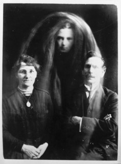 A 'psychic photograph', c1890-c1910. This photograph, which supposedly shows a ghost between a
