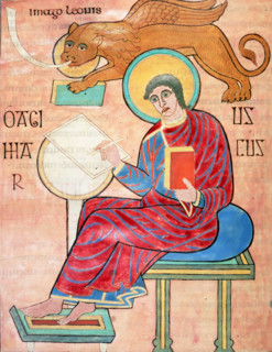 St Mark writing, c700. St Mark sits writing; a winged lion hovers above him. From the Lindisfarne