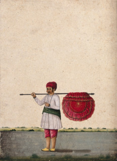 An Indian bearer holding a large, richly decorated fan or banner..., (between 1800 and 1899?). Creator: Unknown.