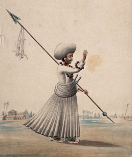 A man holding a long arrow with two puppets (?) hanging from it, (between 1800 and 1899?). Creator: Unknown.