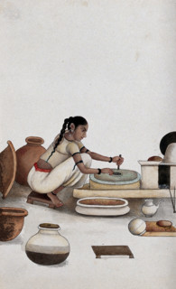 Delhi: a woman grinding grain into flour, (between 1800 and 1899?). Creator: Unknown.