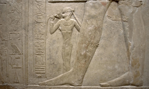 Relief of legs of Mereruka with his wife Watetkhethor..., Mastaba of Mereruka, Egypt, 2003.   Creator: Unknown.