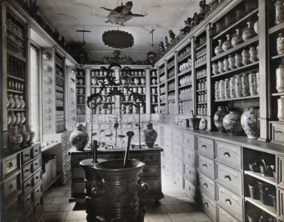 A seventeenth-century German apothecary's shop with ornate pharmacy jars..., c1900s. Creator: Christof Muller.