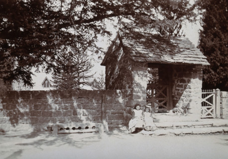 Mitchel Troy, Wales: lich-gate and stocks outside the church, c1890. Creator: Unknown.