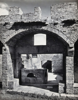 Partly ruined buildings in Ostia identified as a tavern or hot-food shop (thermopolium)..., 1920-9. Creator: Domenico Anderson.