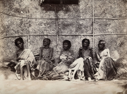Famine in Mysore, India: six emaciated women, five sitting and one leaning on another's lap, 1876-78 Creator: Willoughby Wallace Hooper.
