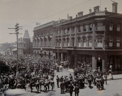South Africa: a crowd of people gathered outside The Goldfields offices in Johannesburg, 1896. Creator: Unknown.