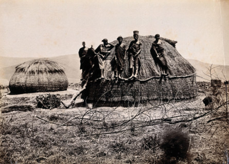 Africa: a group of African people standing on a kraal hut, between 1800 and 1899. Creator: Unknown.