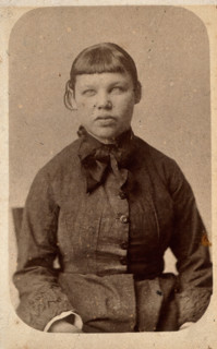 A young woman with a short fringe, showing signs of mental deficiency, c1860s. Creator: John Davis.