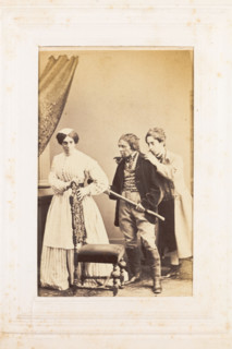 Three men, one in drag, acting out a scene, [between 1890 and 1899?]. Creator: Unknown.
