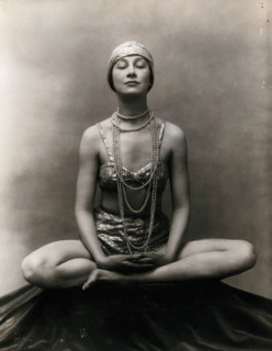Marguerite Agniel posing with her legs crossed and hands together resting on her legs, 1929. Creator: Unknown.