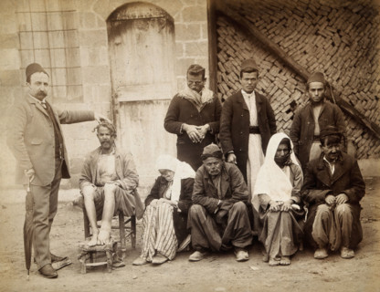 A group of people with leprosy in Jerusalem: a man in a striped suit..., c1890s. Creator: Unknown.