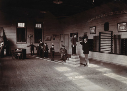 Metropolitan Lunatic Asylum, Kew, Victoria (Australia): boys walking along a ladder laid upon... Creator: Unknown.