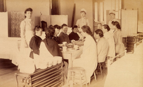 Bellevue Hospital, New York City: women patients (mentally ill?) having a meal..., 1885-1898. Creator: Unknown.
