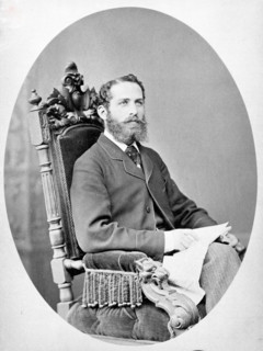 Arthur Schuster, seated, facing left, aged about 38, c1888. Creator: L Suscipj.