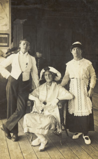 Three soldiers, two in drag, pose in costume, c1920. Creator: Unknown.