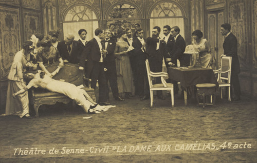 French or Belgian prisoners of war, some in drag, posing on stage during a crowded scene..., [1918?] Creator: Unknown.