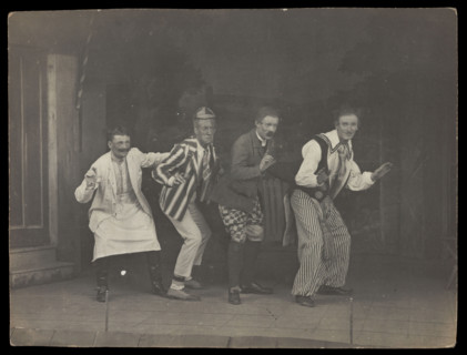 Sailors on stage in mid-pose, wearing a variety of costumes, [between 1910 and 1919?]. Creator: Unknown.