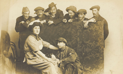 Actors gathered around a man in drag, between 1910 and 1919. Creator: Unknown.