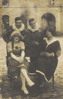 Members of 'The Stars' concert party, two soldiers in drag and two as pierrots, pose around..., 1919 Creator: Unknown.
