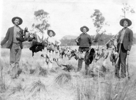 Unknown men and boy with a successful duck shoot, c1900s. Creator: Robert Augustus Henry L'Estrange.