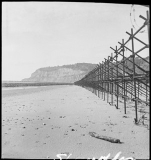 View looking south along the beach at Shanklin, showing Admiralty scaffolding, Isle Of Wight, 1945. Creator: George R Long.
