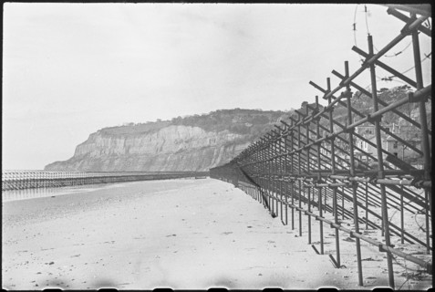 View looking south along the beach at Shanklin, showing Admiralty scaffolding, Isle Of Wight, 1945. Creator: George R Long.