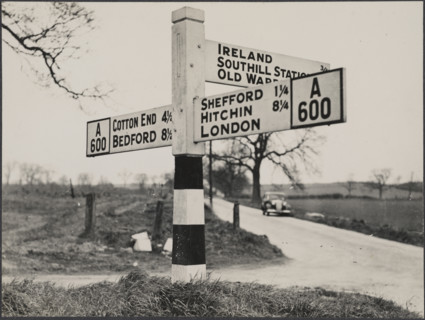 Finger post road sign on the A600 between Bedford and Shefford, Southill, 1940-1960. Creator: George R Long.