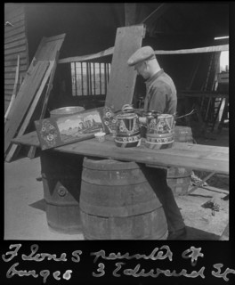 Barge painter Frank Jones, of 3 Edward Street, at work, Leighton Buzzard, Bedfordshire, 1910-60. Creator: George R Long.