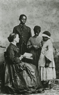 Portrait of teacher Laura M. Towne, a founder of the Penn School, with students..., February 1866. Creator: Unknown.