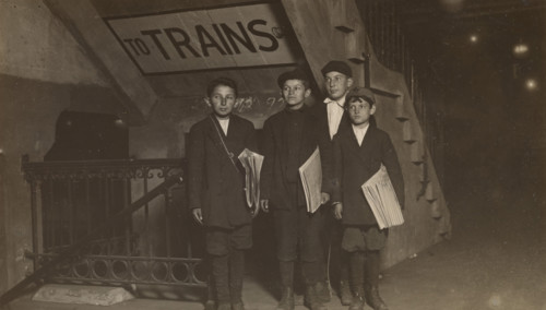 Four Newsies at an Entrance to the Subway, New York City, 1910. Creator: Lewis Wickes Hine.