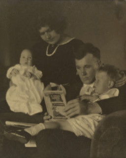 Family Portrait with A Child's Garden of Verses, about 1920. Creator: Louis Fleckenstein.