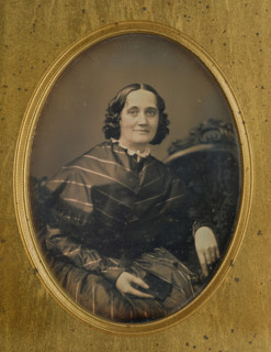 Portrait of a woman holding a book, about 1850. Creator: Southworth and Hawes.