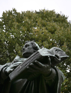 Bronze statue of Martin Luther next to the Marienkirche, (St Mary's Church), Berlin, Germany, 2025.  Creator: LTL.