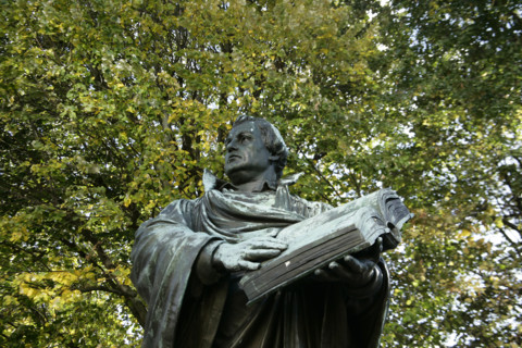 Bronze statue of Martin Luther next to the Marienkirche, (St Mary's Church), Berlin, Germany, 2025.  Creator: LTL.