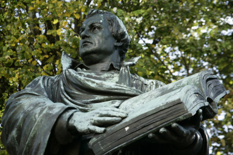 Bronze statue of Martin Luther next to the Marienkirche, (St Mary's Church), Berlin, Germany, 2025.  Creator: LTL.
