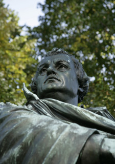 Bronze statue of Martin Luther next to the Marienkirche, (St Mary's Church), Berlin, Germany, 2025. Creator: LTL.