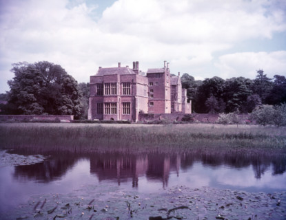 Broughton Castle and moat, Oxfordshire, c1955. [gateway, church] Creator: Arthur Charles Kirby Ware.